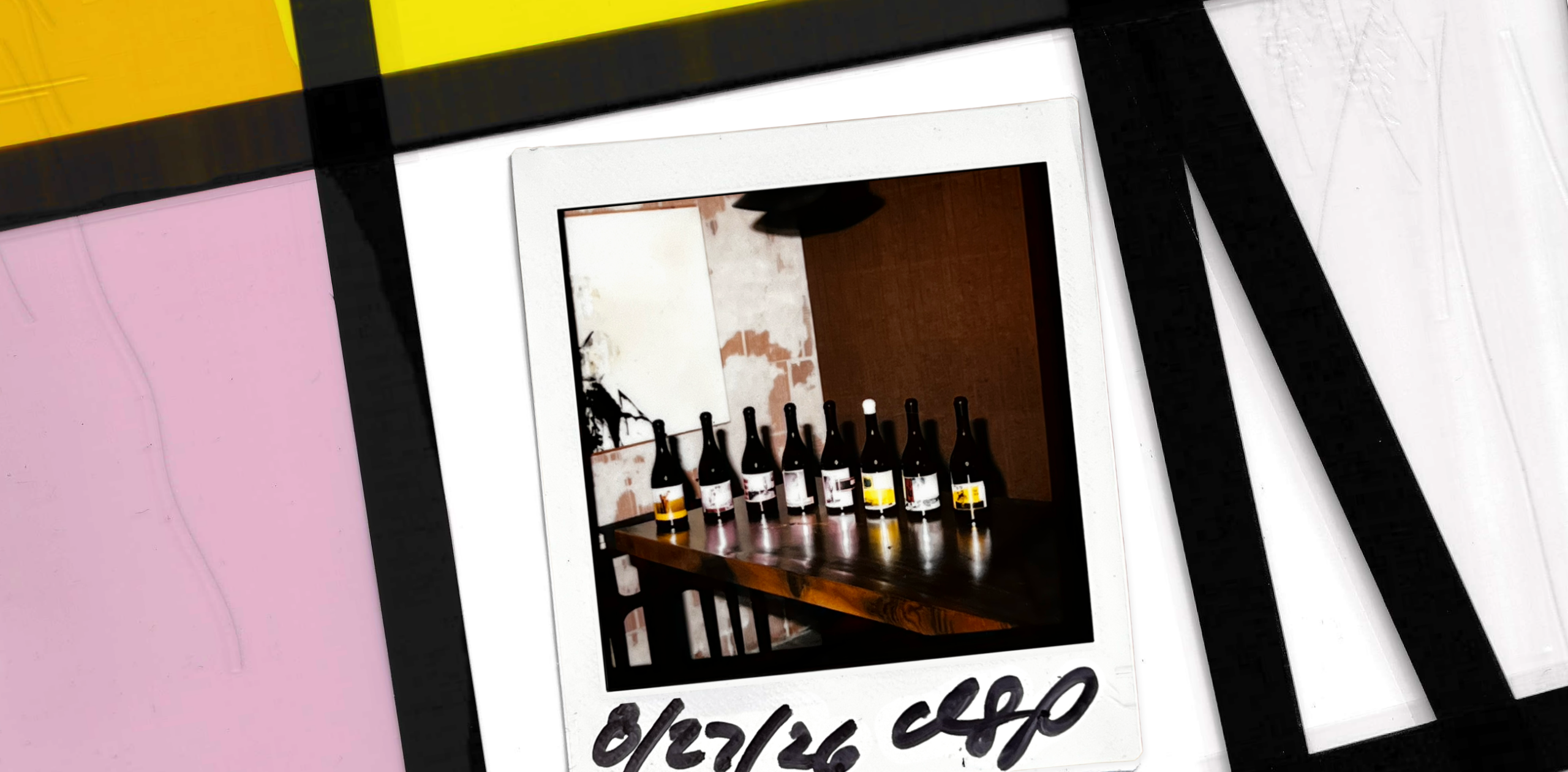 A polaroid of the new labels of 8 Years in the Desert bottle line up on a film strip.